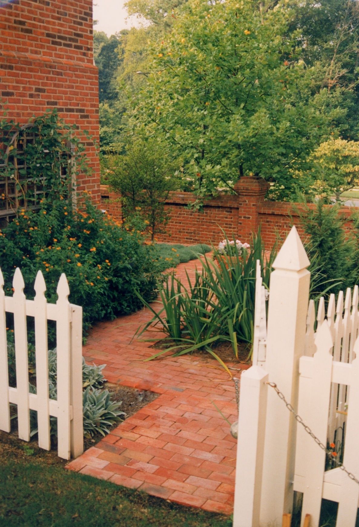 Picket fence brick walk side yard